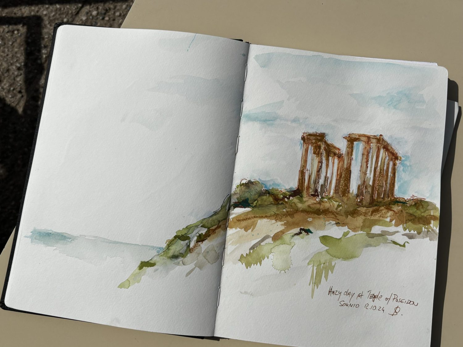 Hazy day at temple of Poseidon - Sonnio A vue of the temple of Poseidon as seen from the restaurant below